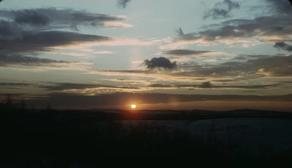 Sunset over a snow-covered landscape, about 1941–42