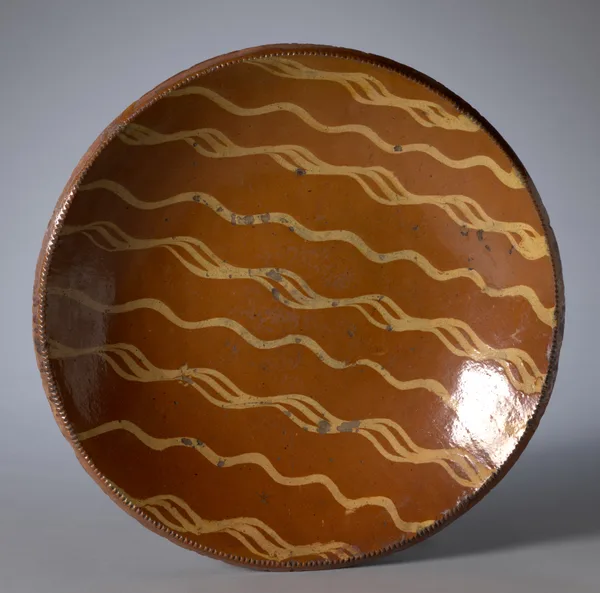 Slip-decorated redware dish, Pennsylvania, early 19th century